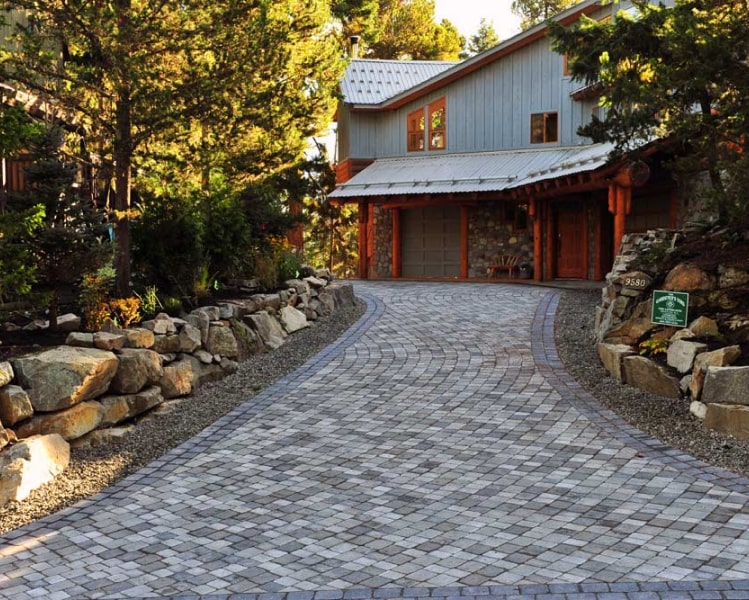 Curved paver driveway stone wall