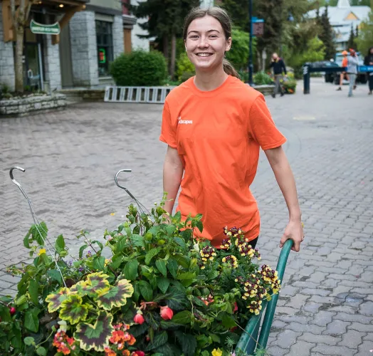 Staff member flower planter village